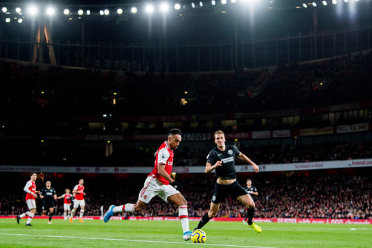 Pierre-Emerick Aubameyang of Arsenal and Dan Burn of
