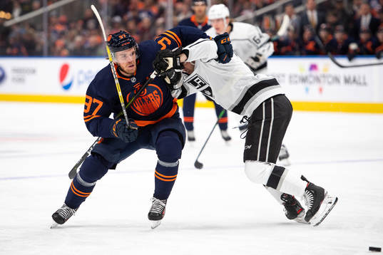 Connor McDavid of the Edmonton Oilers and Sean Walker of