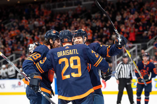 James Neal, Leon Draisaitl and Alex Chiasson celebrate