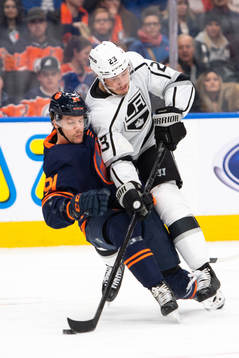 Gaetan Haas of the Edmonton Oilers and Dustin Brown of the