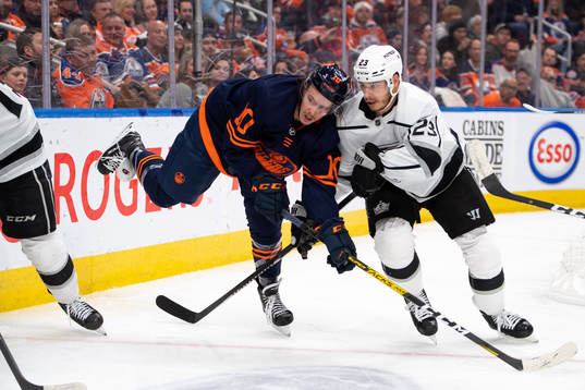 Joakim Nygard of the Edmonton Oilers and Dustin Brown of