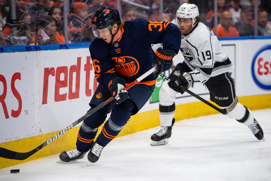 Joel Persson of the Edmonton Oilers and Alex Iafallo of the
