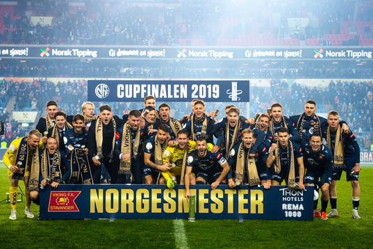 Players of Viking celebrate with the trophy
