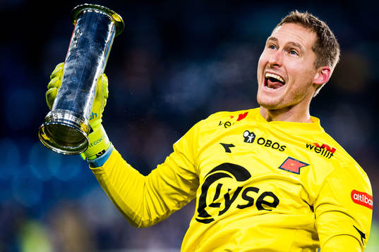 Goalkeeper Iven Austbø of Viking celebrates with the trophy