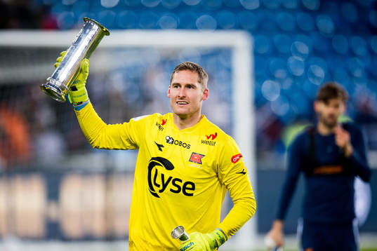 Goalkeeper Iven Austbø of Viking celebrates with the trophy