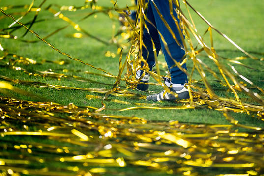 A player walks in confetti