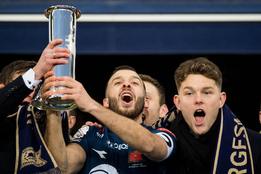 Zlatko Tripic of Viking celebrates with the trophy