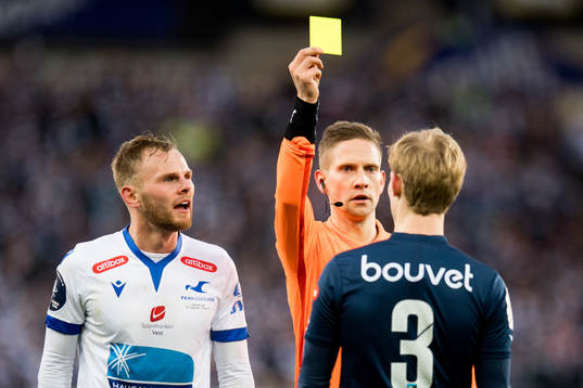 Viljar Helland Vevatne of Viking is shown a yellow card by