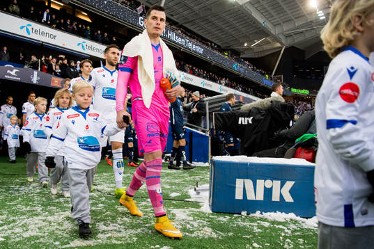 Goalkeeper Helge Sandvik of Haugesund enters the pitch