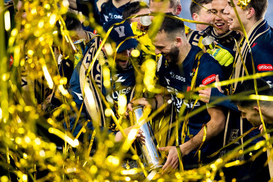 Zlatko Tripic of Viking celebrates with the trophy