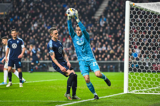 Sören Rieks of Malmö FF and goalkeeper Karl-Johan