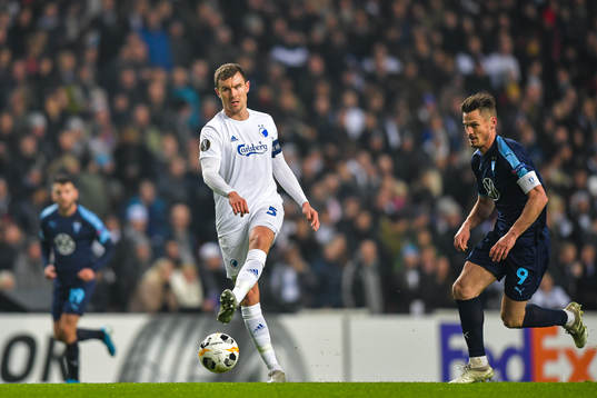 Andreas Bjelland of FC Köpenhamn and Markus Rosenberg of