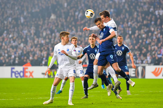 Andreas Bjelland of FC Köpenhamn and Markus Rosenberg of