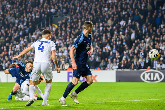 Arnor Traustason of Malmö FF (left) scores the game