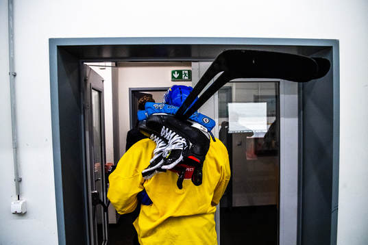 A player of Sweden leaves the rink