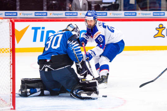 Samuel Knazko of Slovakia against goalkeeper Justus Annunen