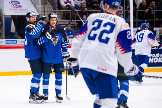 Aku Räty and Eemil Erholtz of Finland celebrate the 6-0
