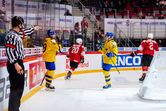 Lucas Raymond and Karl Henriksson of Sweden celebrate