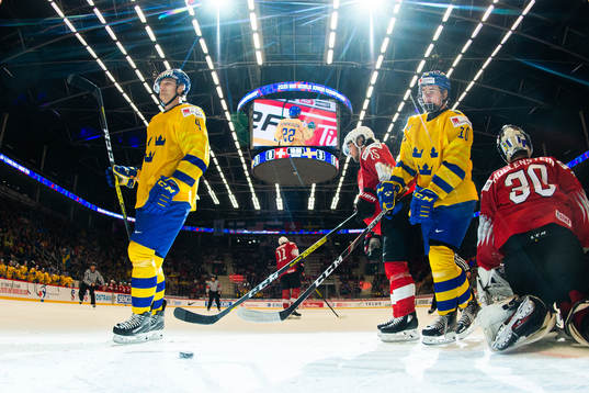 Adam Ginning and Alexander Holtz of Sweden celebrate the
