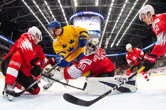Lucas Raymond of Sweden collides with goalkeeper Luca