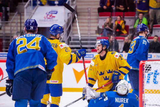 Samuel Fagemo and Nils Höglander of Sweden celebrate