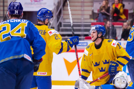 Samuel Fagemo and Nils Höglander of Sweden celebrate