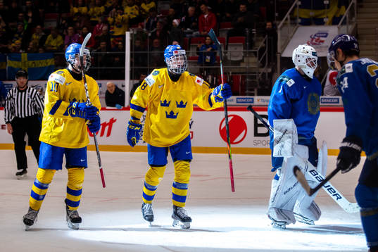 Alexander Holtz and Lucas Raymond of Sweden celebrate the
