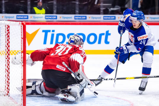 Dominik Jendek of Slovakia against goalkeeper Luca