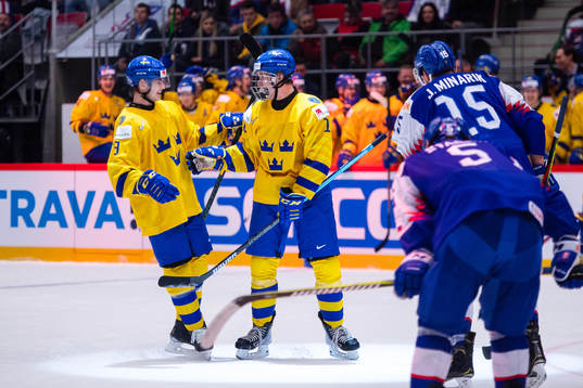 Victor Söderström and Alexander Holtz of Sweden celebrate