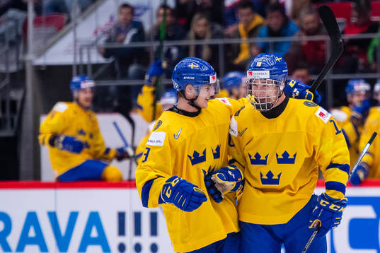 Victor Söderström and Alexander Holtz of Sweden celebrate
