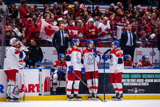 Players of Czech Republic await a goal review