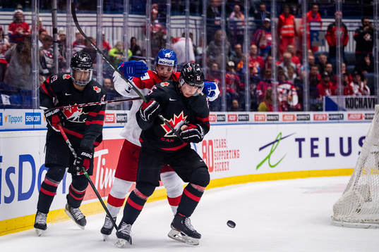 Quinton Byfield and Aidan Dudas of Canada against Adam
