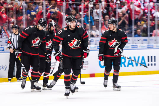 Liam Foudy of Canada celebrate with teammates