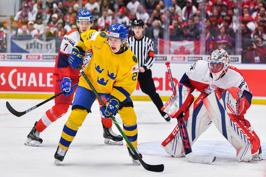 Karl Henriksson of Sweden and goalkeeper Lukas Dostal of