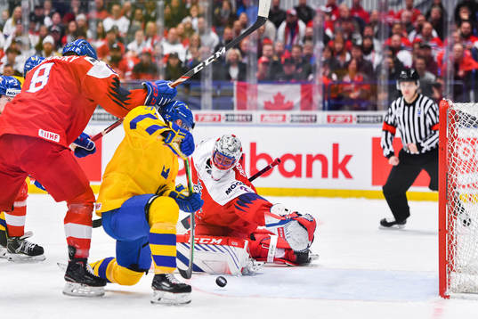 Nils Höglander of Sweden score 1-0 behind goalkeeper Lukas