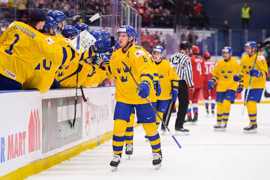 Rasmus Sandin of Sweden celebrate with teammates