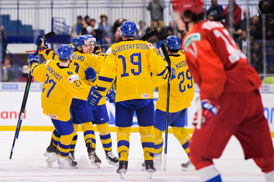 Rasmus Sandin of Sweden celebrate with teammates