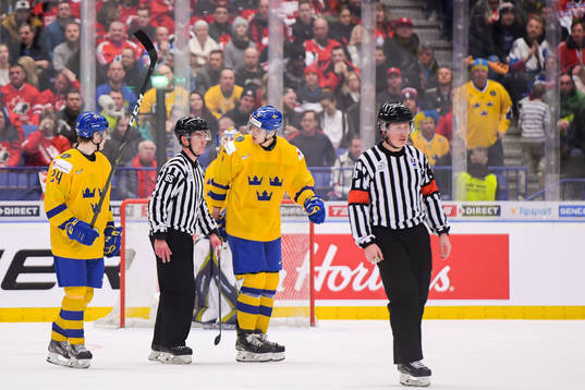 Philip Broberg of Sweden in a discussion with the referee