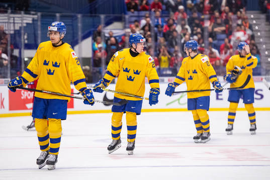 Linus Nässén and Linus Öberg of Sweden look dejected