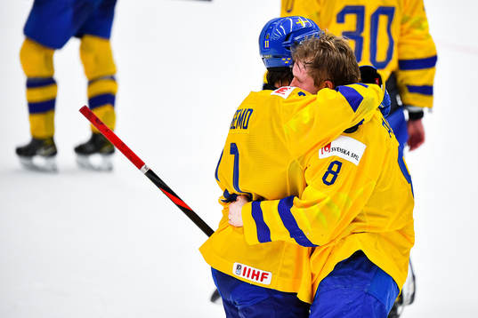 Samuel Fagemo and Rasmus Sandin of Sweden look dejected
