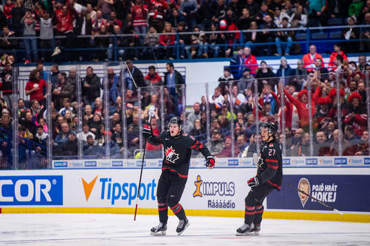 Alexis Lafreniere and Barrett Hayton of Canada celebrates