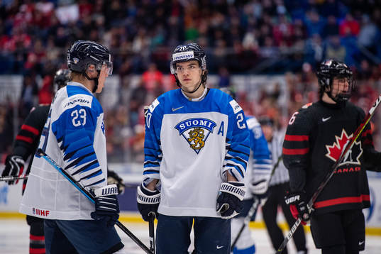 Ville Petman and Matias Macceli of Finland look dejected