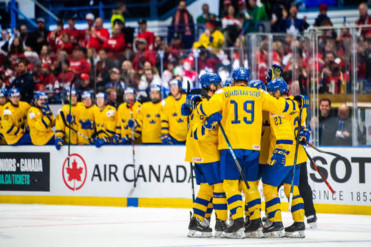Rasmus Sandin of Sweden celebrate with teammates