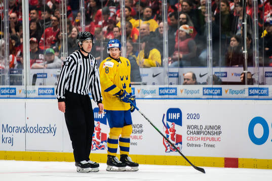 Rasmus Sandin of Sweden in a discussion with the referee