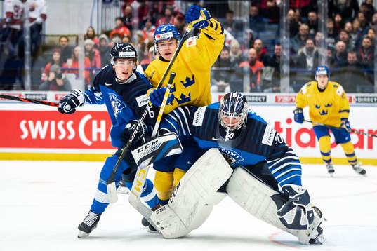 Peetro Seppala and goalkeeper Justus Annunen of Finland