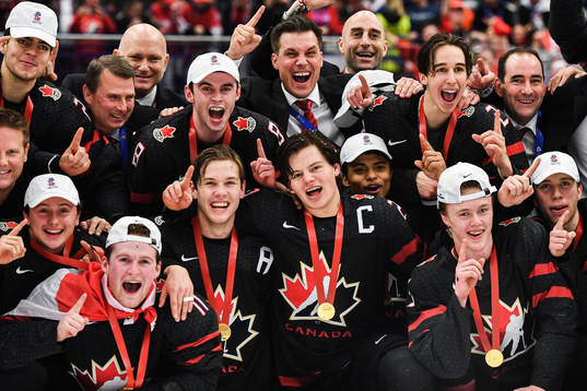 Alexis Lafreniere of Canada celebrate with teammates