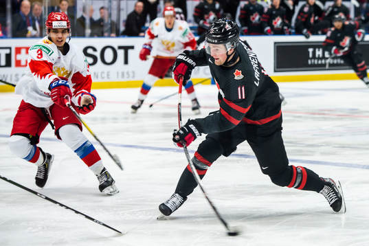 Danila Galenyuk of Russia and Alexis Lafreniere of Canada