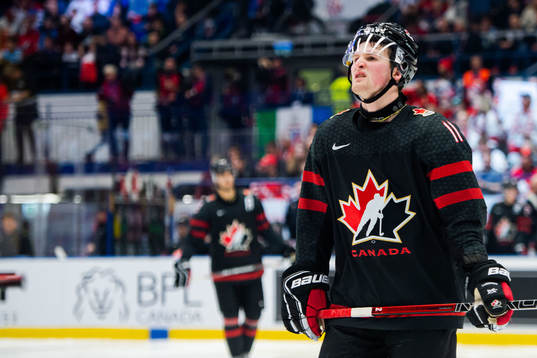 Alexis Lafreniere of Canada looks dejected