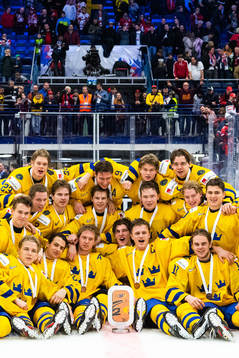 Players of Sweden celebrate with the trophy