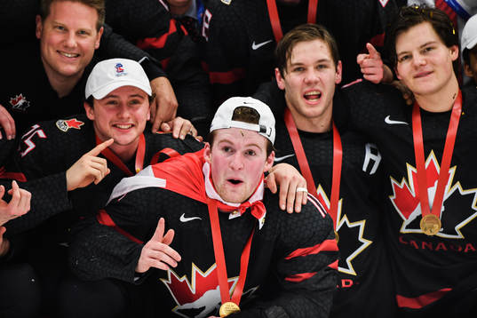 Alexis Lafreniere of Canada celebrate with teammates